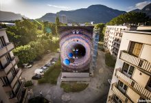 Photo of foto | Și-a lăsat amprenta și pe o clădire din Franța. Artista moldoveancă iZZY iZVNE, autoarea unei picturi murale în stilul său cosmic